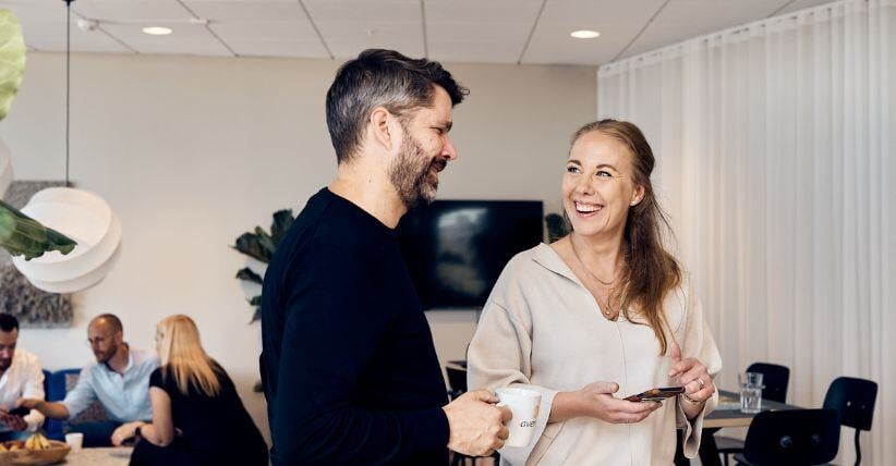 Two colleagues laughing